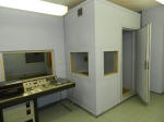 The radio studio with a soundproof cabin for broadcasters